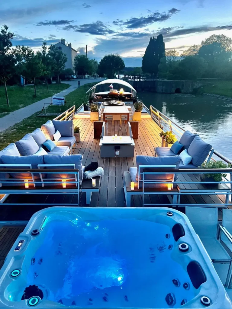 The sundeck and spa tub at dusk