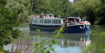 The Kir Royale cruising past vineyards on the River Marne