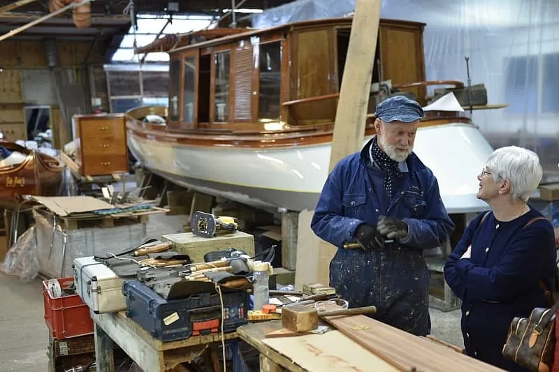 Wooden boat workshop with craftsmen