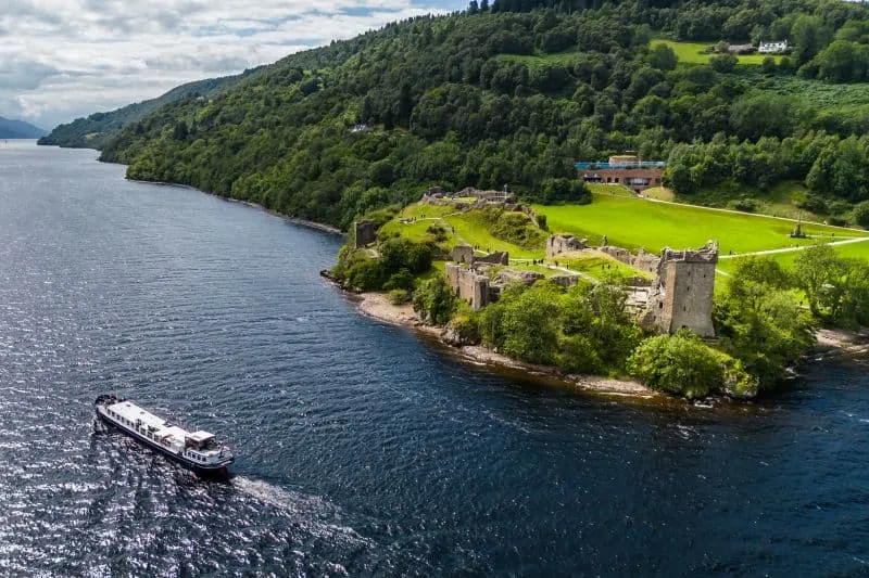 The Scottish Highlander cruising past Urquhart Castle on Loch Ness