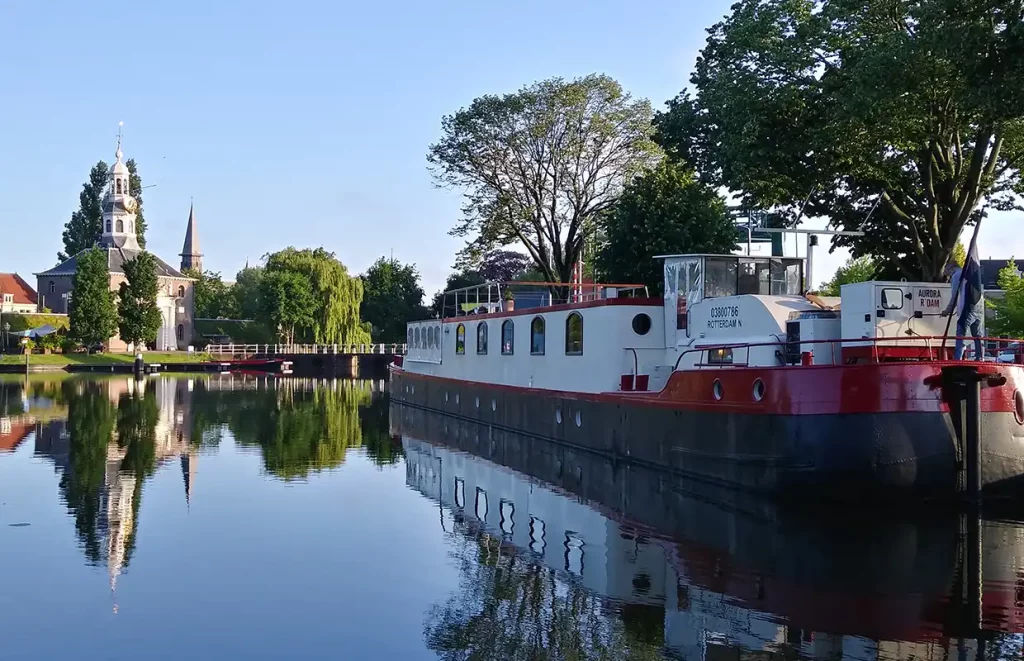 The Aurora moored along a canal bank