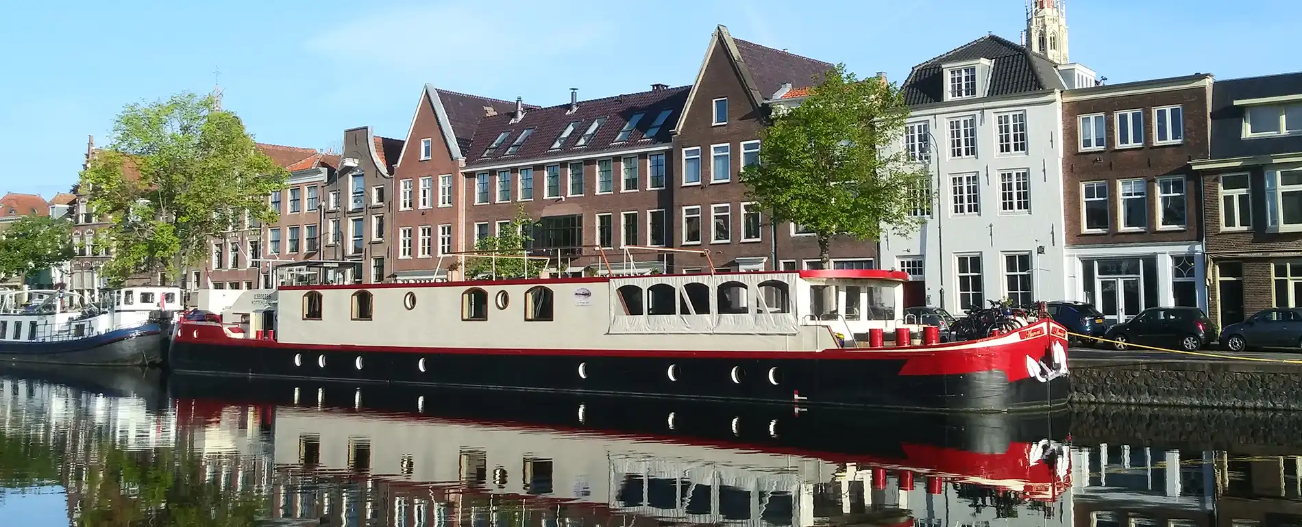 The Aurora berthed on a quiet waterway